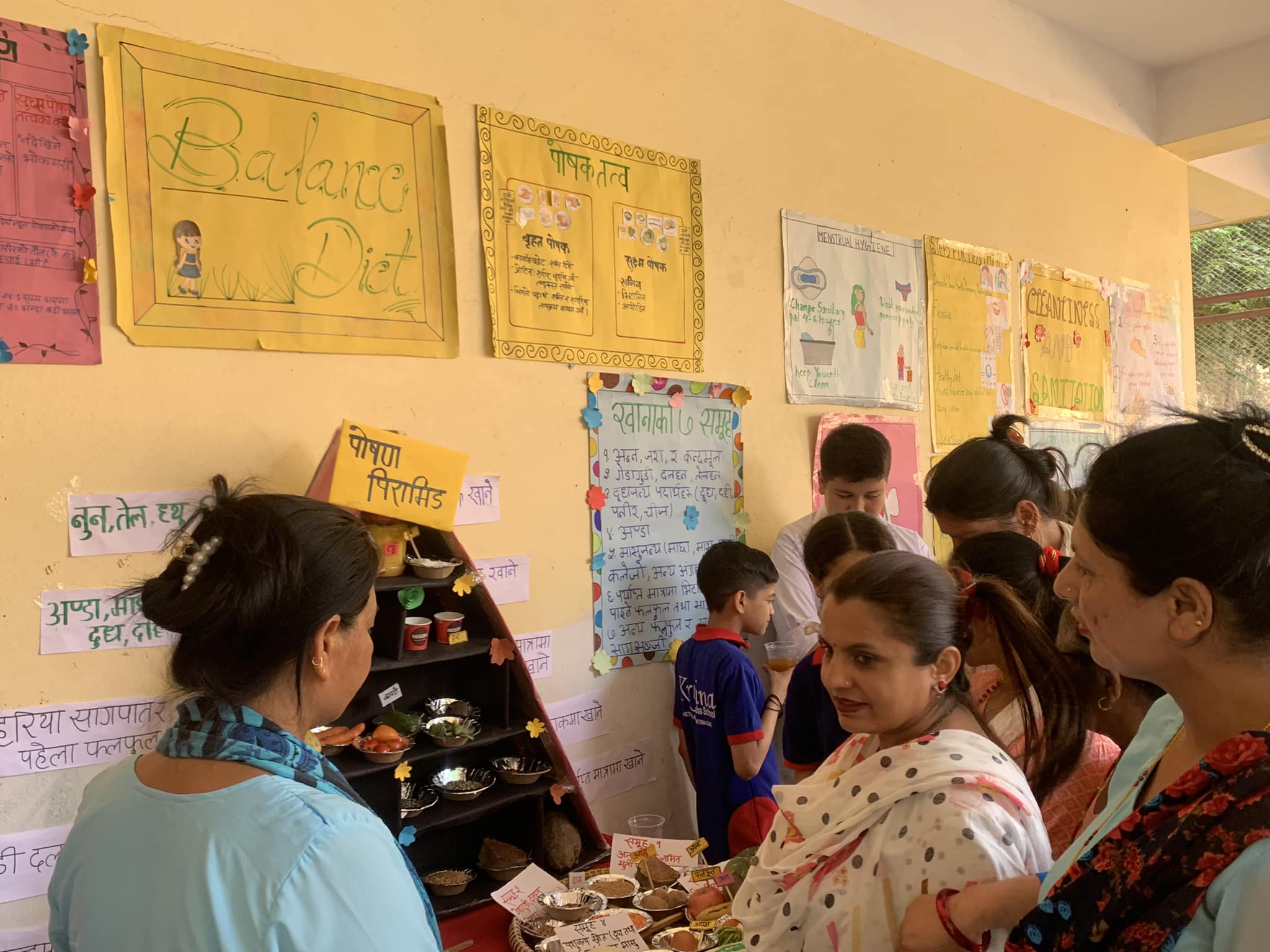 May be an image of 5 people, people studying and text