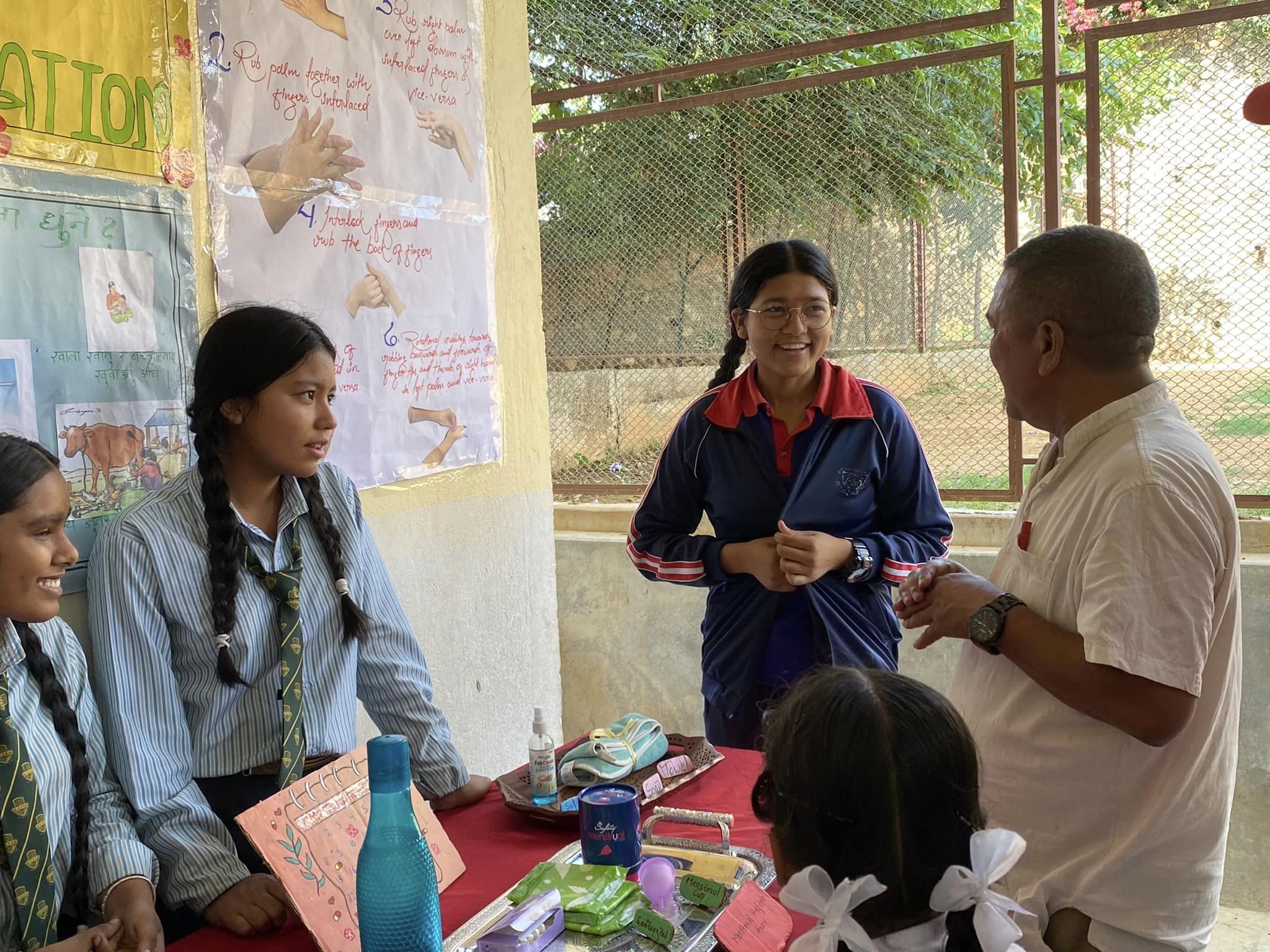 May be an image of 5 people, people studying and text